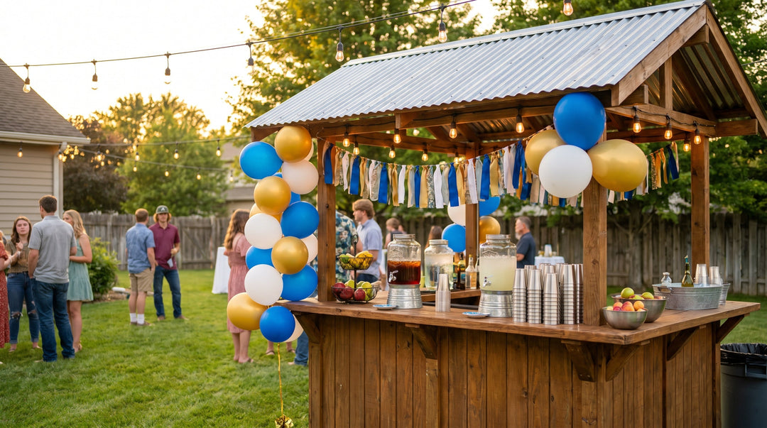 Backyard graduation party at golden hour with a wooden bar set up as a drink station under string lights