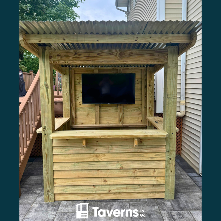 Wooden outdoor bar with TV screen on a patio