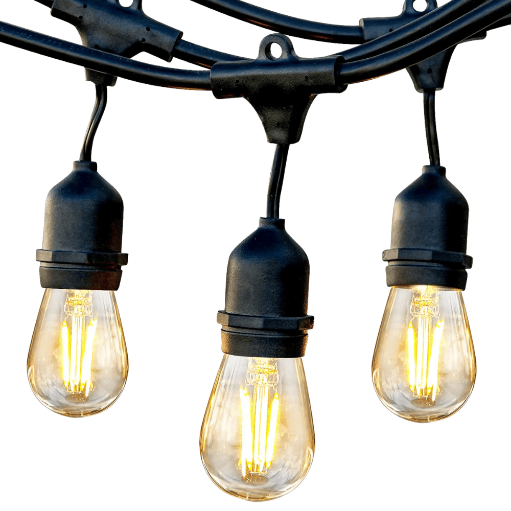 String of three illuminated light bulbs with black connectors on a white background