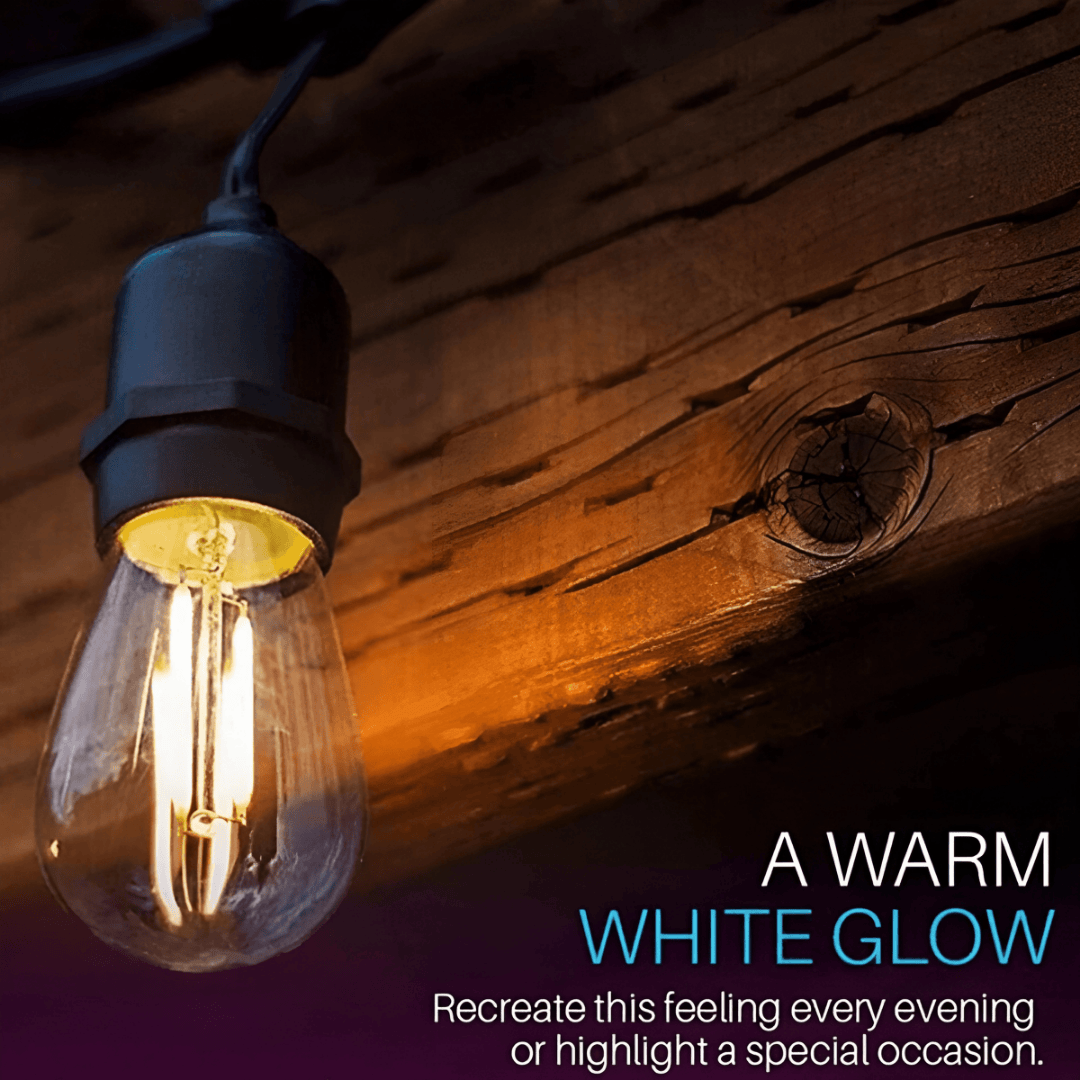Light bulb with warm glow on wooden surface, text &