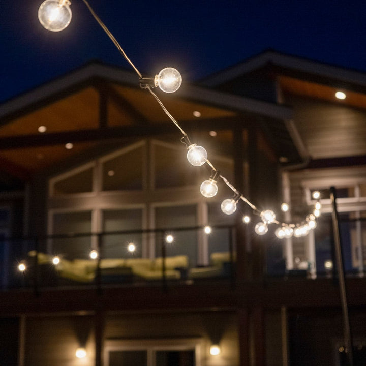 String lights hanging outside a house at night