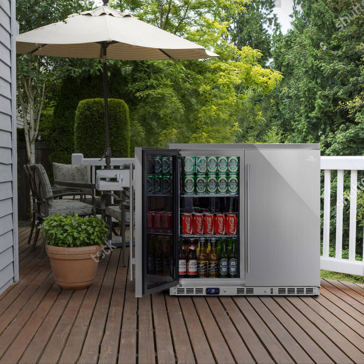 Outdoor setting with a patio table, chairs, and an open outdoor refrigerator filled with drinks.