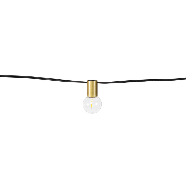 String light bulb with gold fixture on a white background