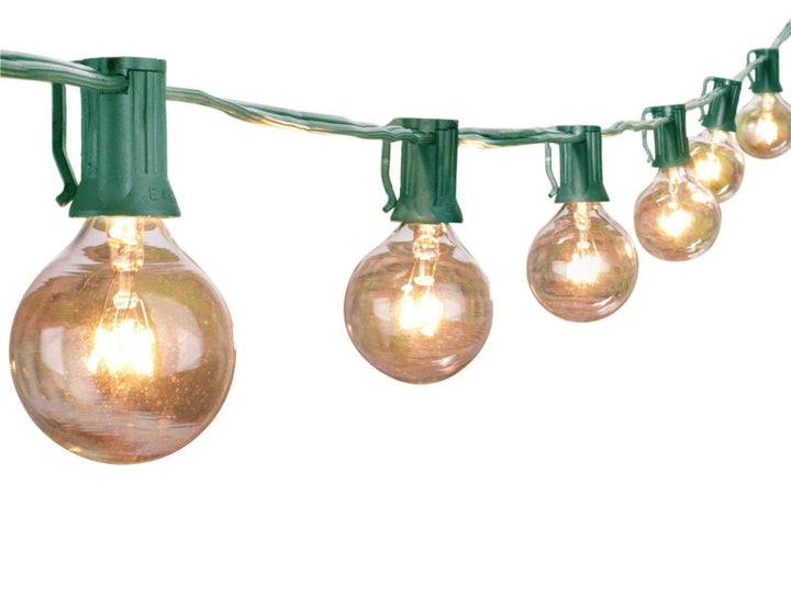 A string of round G40 Edison glass bulbs with a warm white glow, mounted on a black cord.