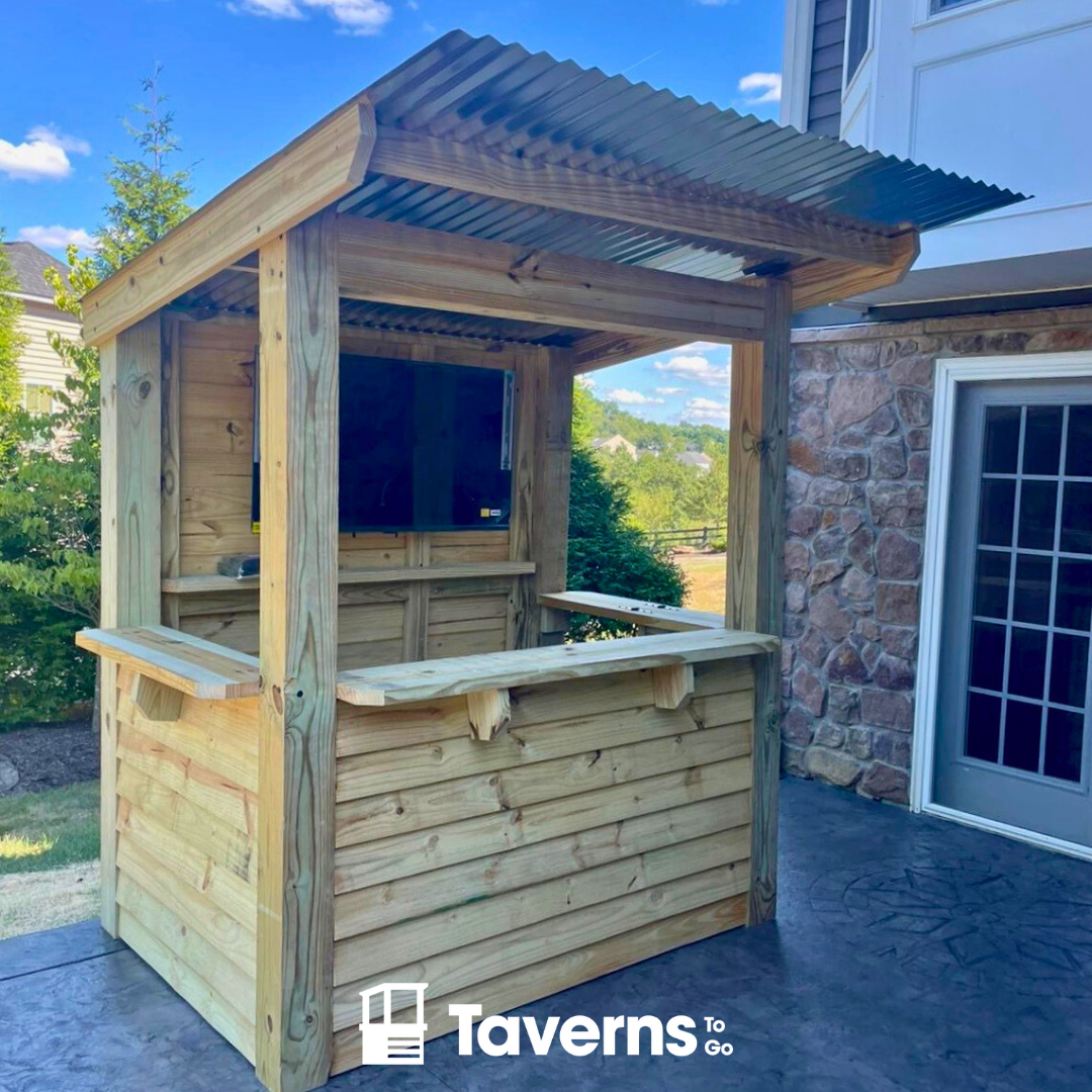 Wooden outdoor bar with a corrugated metal roof on a patio, branded &