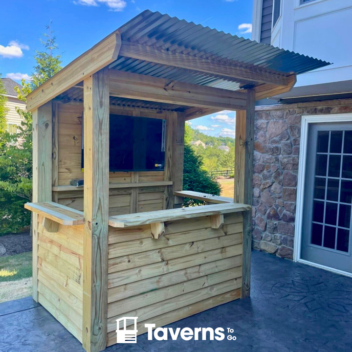 Wooden outdoor bar with a corrugated metal roof on a patio, branded &